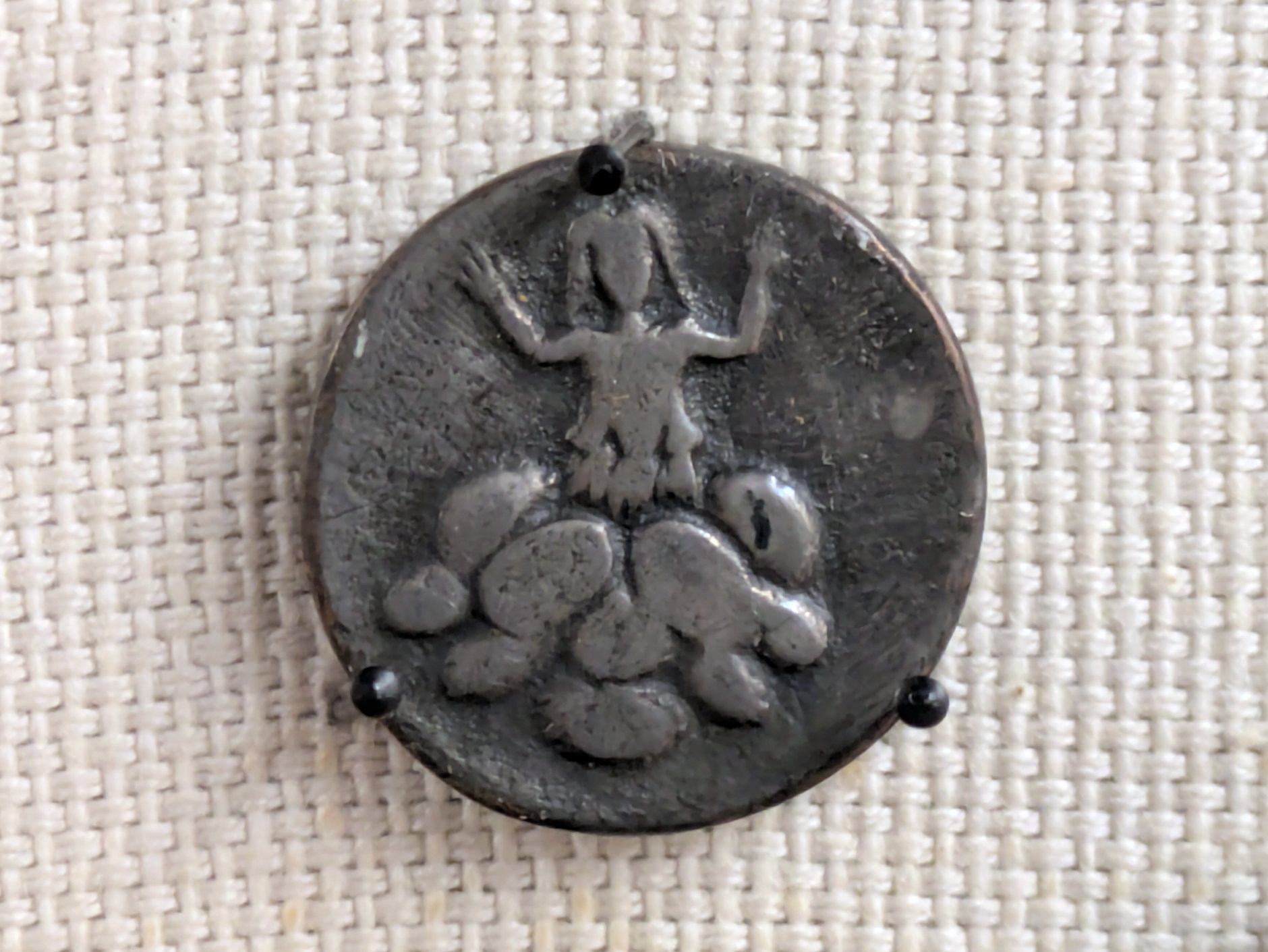 The New Mithraeum / Jon Wright (CC BY-SA) Mithras' silver token found at Verulamium.